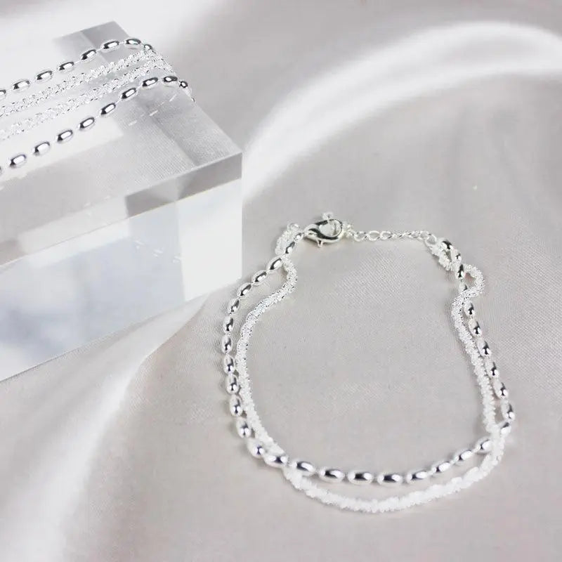 Amparo - Set di Bracciali Argentati Eleganti con Zirconi