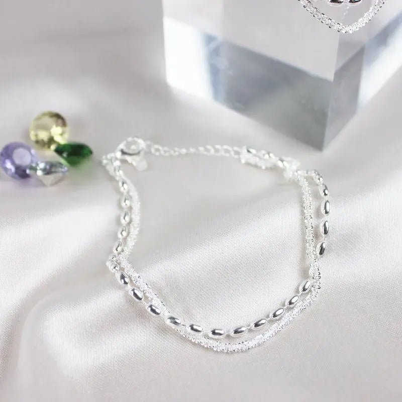 Amparo - Set di Bracciali Argentati Eleganti con Zirconi